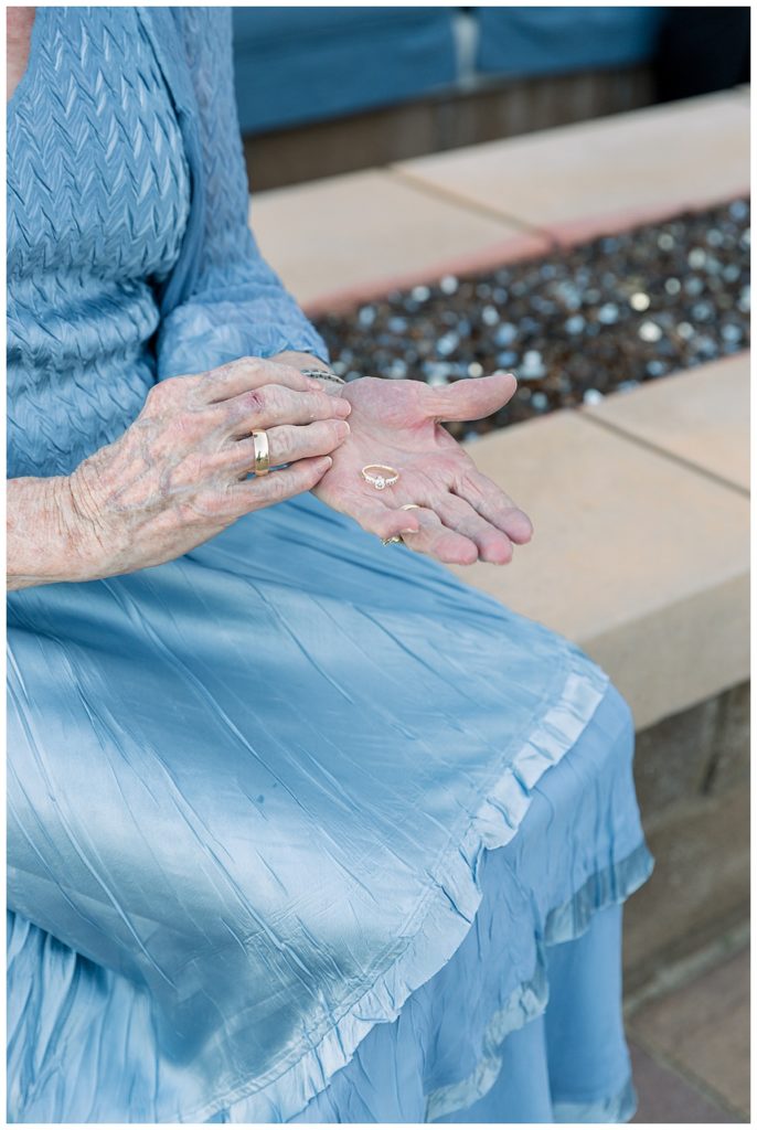 the bride's grandmother holds her wedding ring