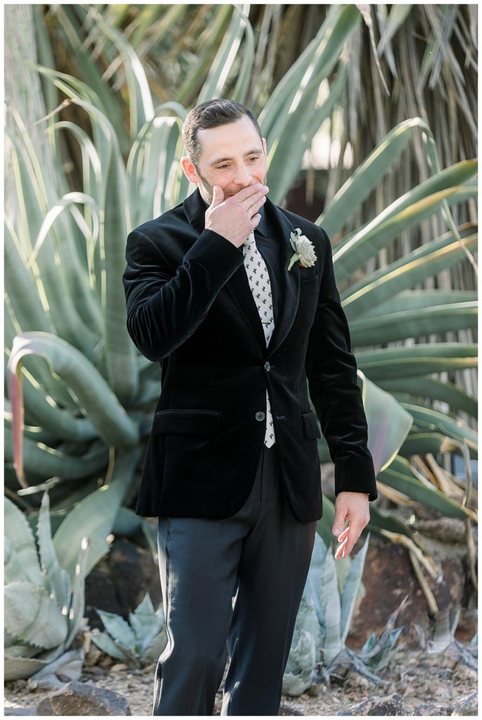 A groom reacts to seeing his bride for the first time at The Desert Botanical Garden
