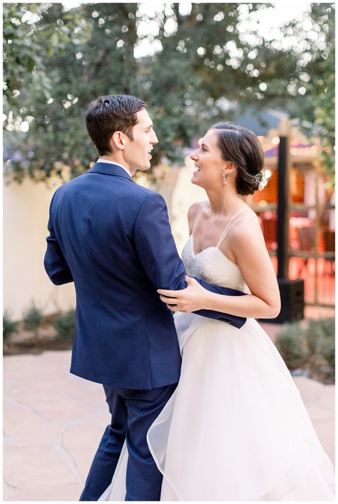 A couple shares their first dance outside at their wedding reception in Scottsdale. 